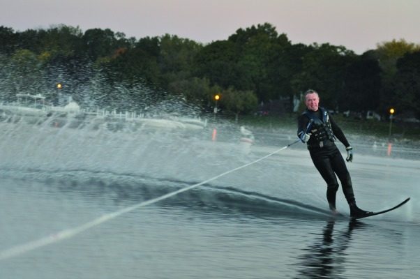 Scott Leitner slices through the cold waters of Geneva Lake during The Gummers early morning waterskiing ritual.