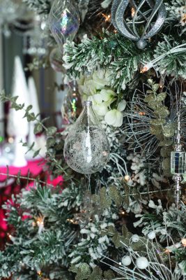 GLANWORTH GARDENS: The dining room tree is flocked to look like freshly fallen snow and decorated with white hydrangeas, eucalyptus boughs accented with silver glitter, and a combination of glistening silver and crystal ornaments.