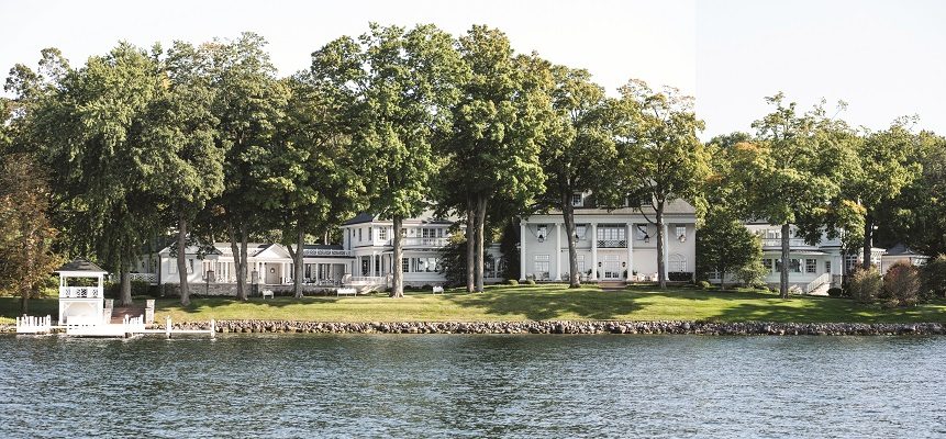 The Southern Colonial- inspired home with its signature columns and symmetrical façade has been drastically increased in size over the years and is an imposing sight on Geneva Lake’s south shore.