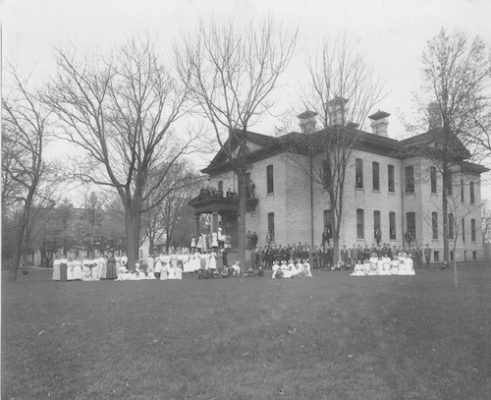 Students, teachers and administrators gather in front of WSD's Main Building for a photograph in the early 1900s. 