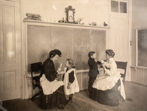  
From its founding, WSD offered co-ed instruction to children as young as 3 years old. Here two teachers instruct students in signing.