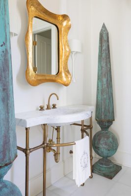 A first-floor powder room demonstrates the home's unique blend of historic and modern accents.