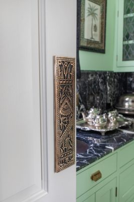 Even the hardware throughout the home was selected to provide historic character, as evidenced by the door between the dining room and the butler’s pantry.
