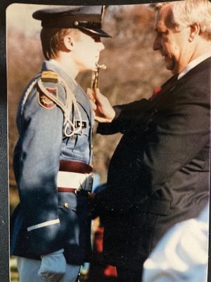 adet Jonathan Ross receives the sword and sabre presentation from his stepfather, Headmaster Daniel Snow, in 1985. Photo courtesy of Jonathan Ross