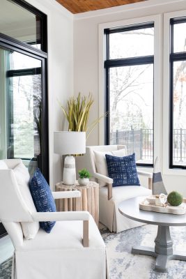 Designed in a Scandinavian style, the first-floor sun room offers a cheerful spot for conversation.