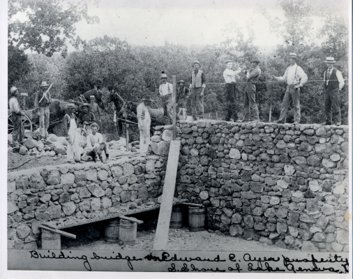 Workers construct a stone bridge on the Ayers’ property. 
Photo courtesy of Laurie Buss.