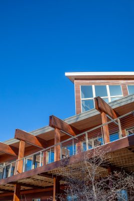 Designed to complement the natural slope of the land, the home’s exterior borrows from the design philosophy of architect Frank Lloyd Wright, particularly in the design of the deck.