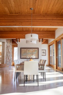 Throughout the home, polished concrete floors contrast with the warm walnut ceilings and trim.