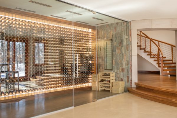 Finished in walnut, the climate- controlled wine vault can hold around 900 bottles.