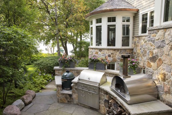 The homeowner added an outdoor kitchen, including a pizza oven, grill and Green Egg grill.