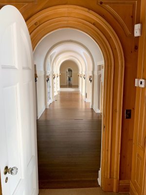  On the second floor, a long hallway in the bedroom wing repeated the arch motif.  Photo courtesy of Geneva Lake Museum