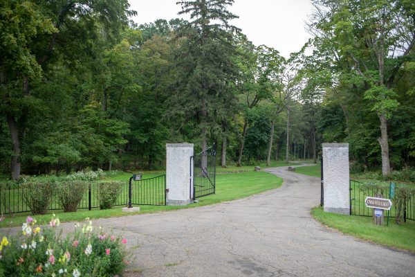 Stucco pillars at the estate’s Snake Road entry greeted anyone arriving by car, leading them to the picturesque, winding driveway.  Photo by Shanna Wolf