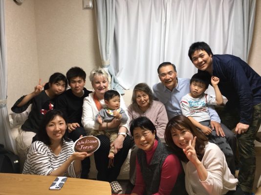 Burrough (third from left), with Ikezawa (center, front) and her family in Japan in 2018.   PHOTO COURTESY OF JERRE BURROUGH