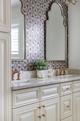 Kathy Hanley of Lake Geneva’s @Home sourced the ornate wall tile and countertops in the upstairs guest bathroom, which complement the Moroccan-style mirrors and gold fixtures.